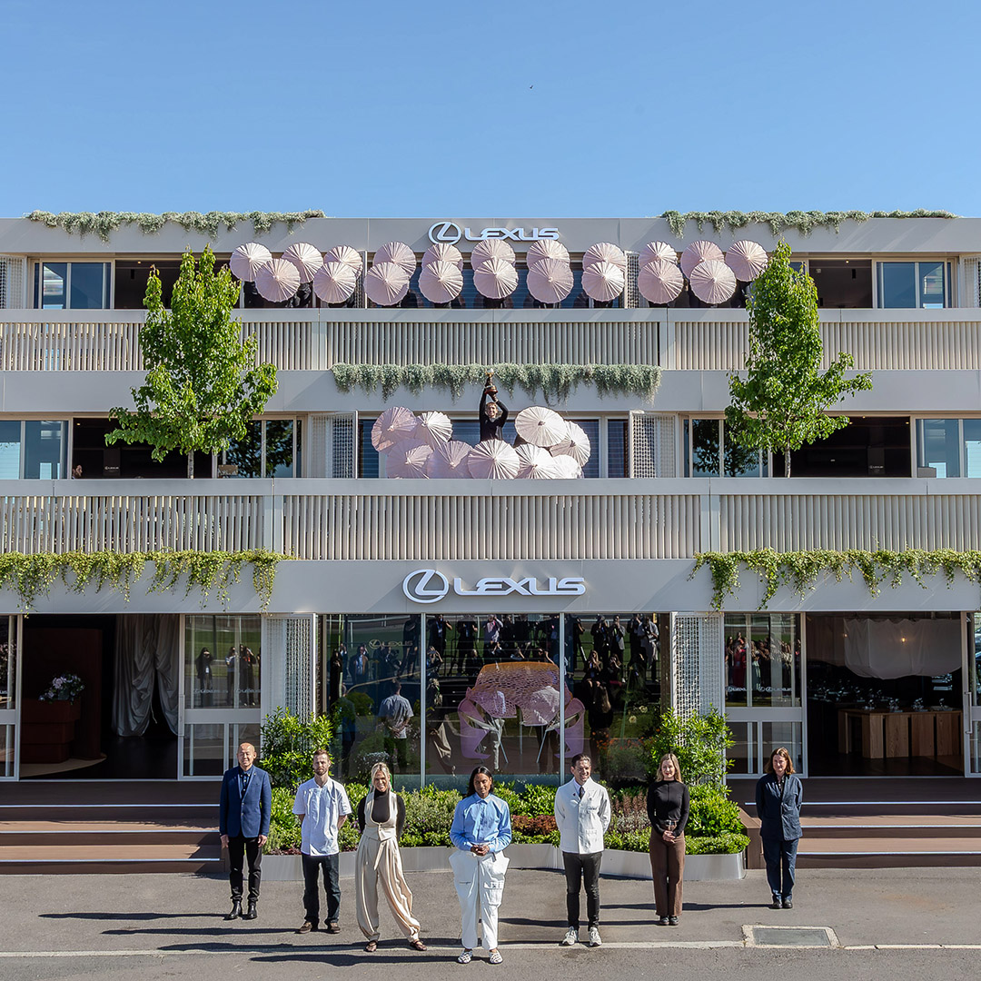 A group of seven people stand outside the Lexus Landmark at the Melbourne Cup