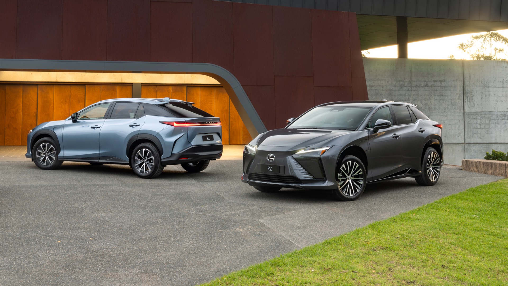 A light blue and dark grey 2023 RZ sit parked on a concrete driveway.