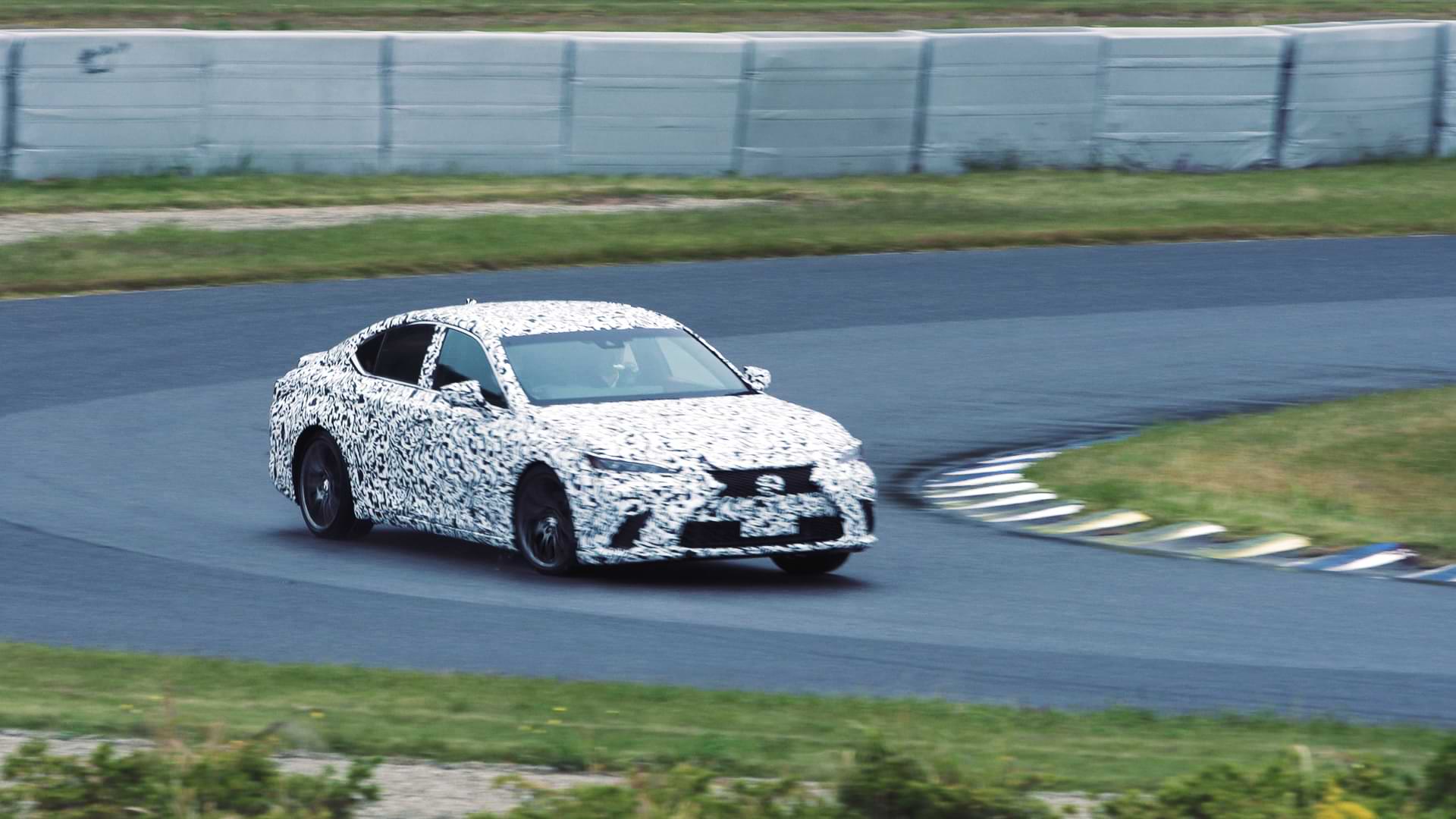 Lexus HEV prototype drives around a racetrack corner.